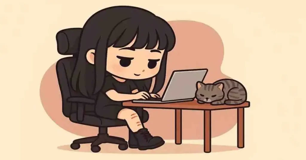 Stile chibi: la mia storia raccontata con le illustrazioni 1 Laura stile chibi scrive al pc su sedia da ufficio col gatto accanto